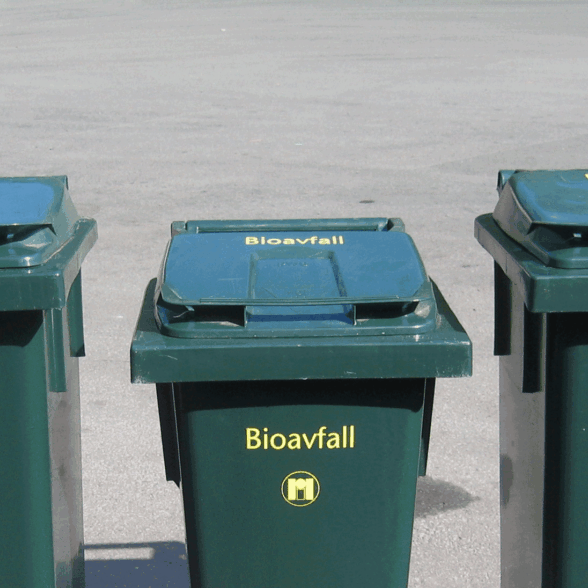 Trilledunker for avfall mot nøytral asfaltbakgrunn